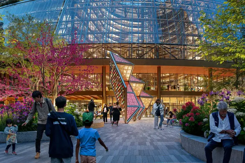 Architectural rendering of the Google Thompson Center outdoor plaza in the Chicago Loop at dusk, featuring Sanford Biggers' 30-foot colorful tiled sculpture, Vector, surrounded by pedestrians, landscaping, and the building's new glass facade.