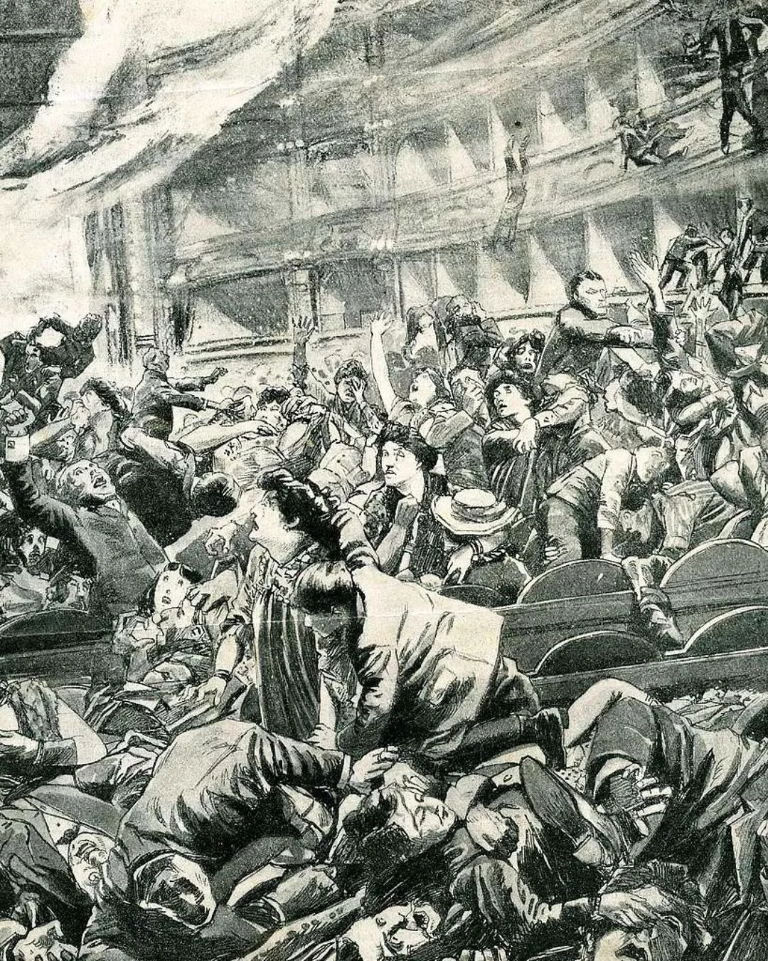 A graphic vintage newspaper illustration showing a panicked crowd crushing together and falling from balconies inside the Iroquois Theatre during the 1903 fire.