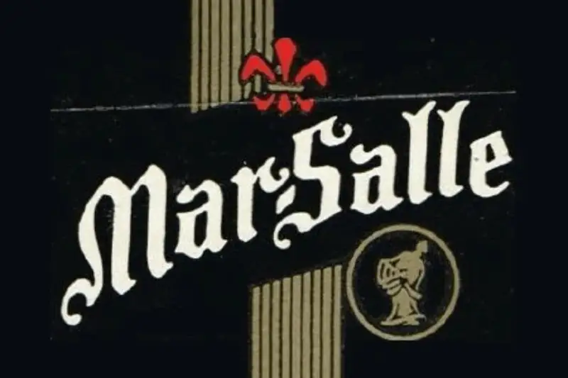 A vintage black label with white gothic lettering, gold accents, and a red fleur-de-lis for Mar-Salle, the former Chicago distillery that produced Jeppson's Malört.